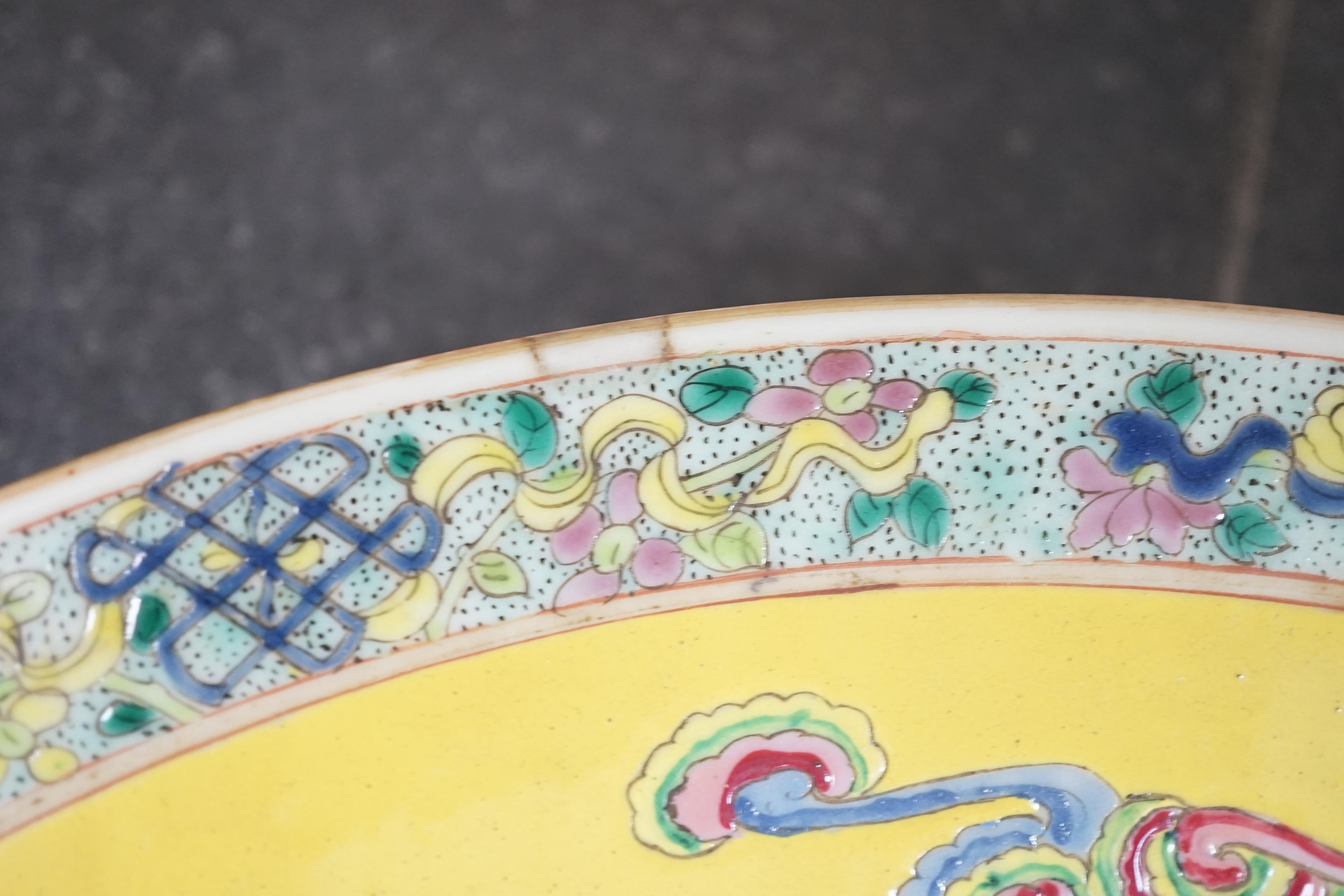 A Chinese yellow ground ‘dragon’ dish, late 19th century, minor damage